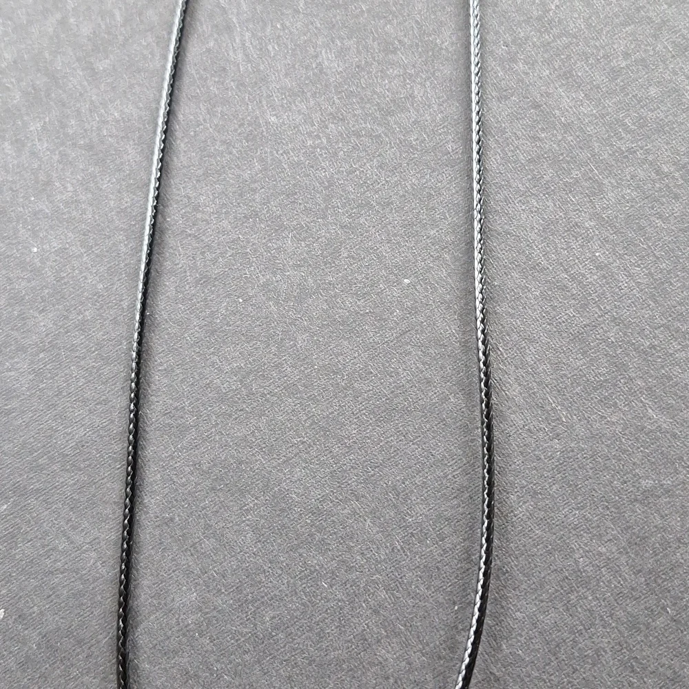 Clear crystal point pendant necklace on 16-inch faux leather chain